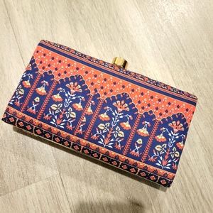 Floral print clutch with sling chain